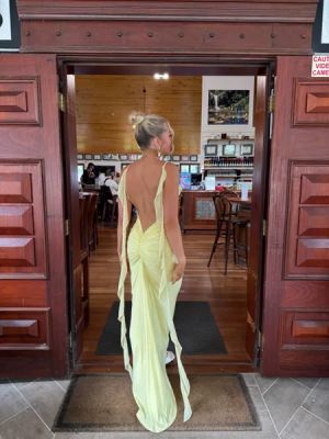 Yellow Open-Back Maxi Dress with Thin Straps and Ruffle Detail