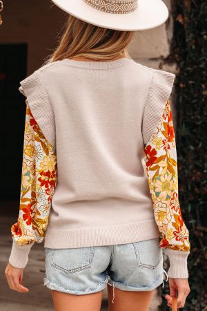 back view of beige sweater with contrast floral sleeves