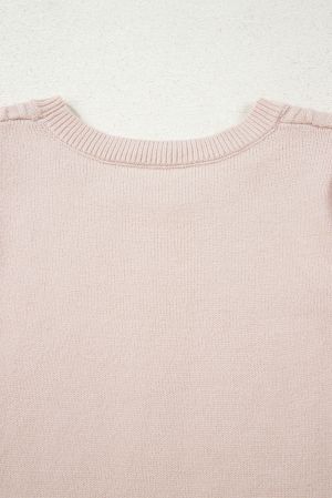 neckline detail of beige knitted women’s sweater