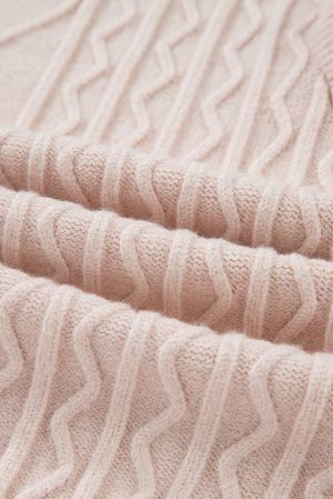 close up textured cable knit pattern on beige sweater