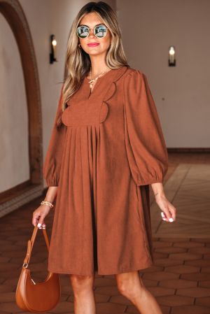 Stylish cinnamon dress with decorative neckline and puff sleeves