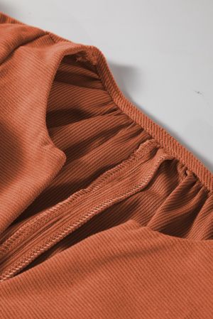 Elastic cuff detail on cinnamon dress sleeve