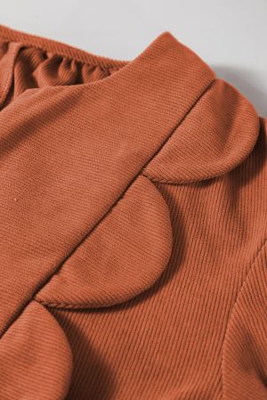 Stitching and fabric detail of cinnamon dress close up