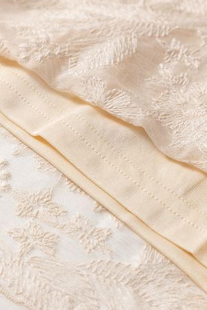 Women's long beige skirt with floral embroidery