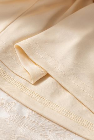 Women's long beige skirt with floral embroidery