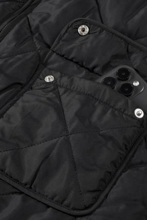 Women’s Reversible Vest with Quilted and Sherpa Sides in Black and White