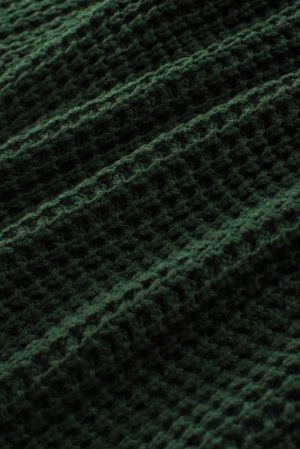 Дамски пуловер в тъмнозелено с ефектни копчета