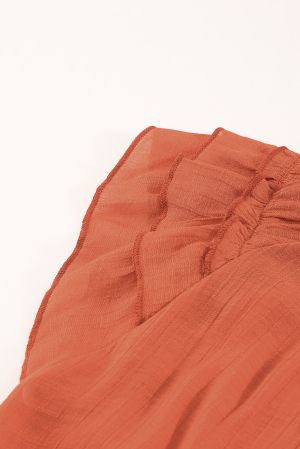 Дамски топ в оранжево с V-образно деколте и ефектни ръкави