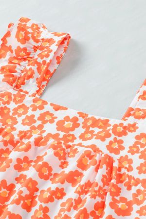 Дамски топ в оранжево с принт на цветя и къдрички при раменете