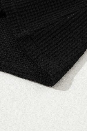 Дамска блуза в черно с къси бухнали ръкави, актуална waffle материя