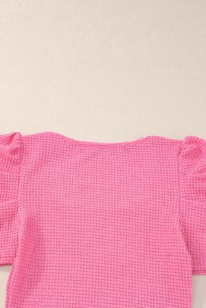 Дамска блуза в розово с къси бухнали ръкави, актуална waffle материя